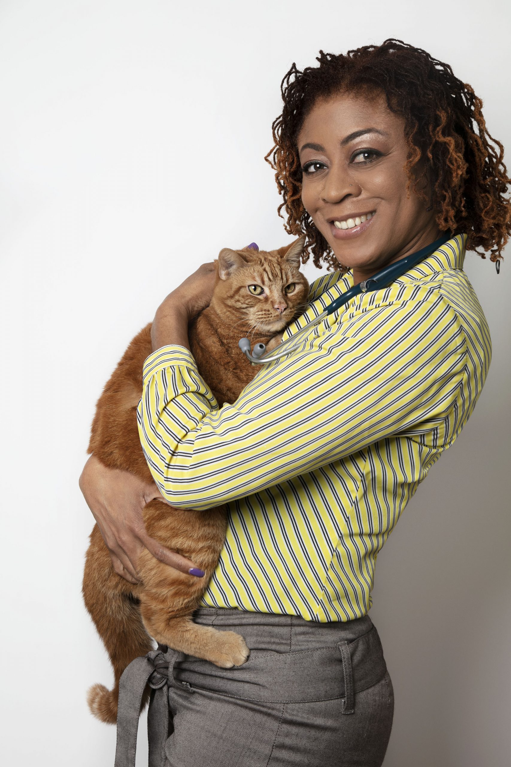 Image of Dr. Brown holding an orange cat